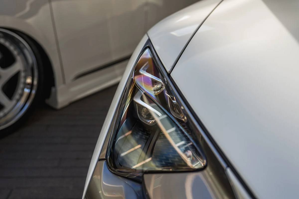 Headlight detail on a white coupe