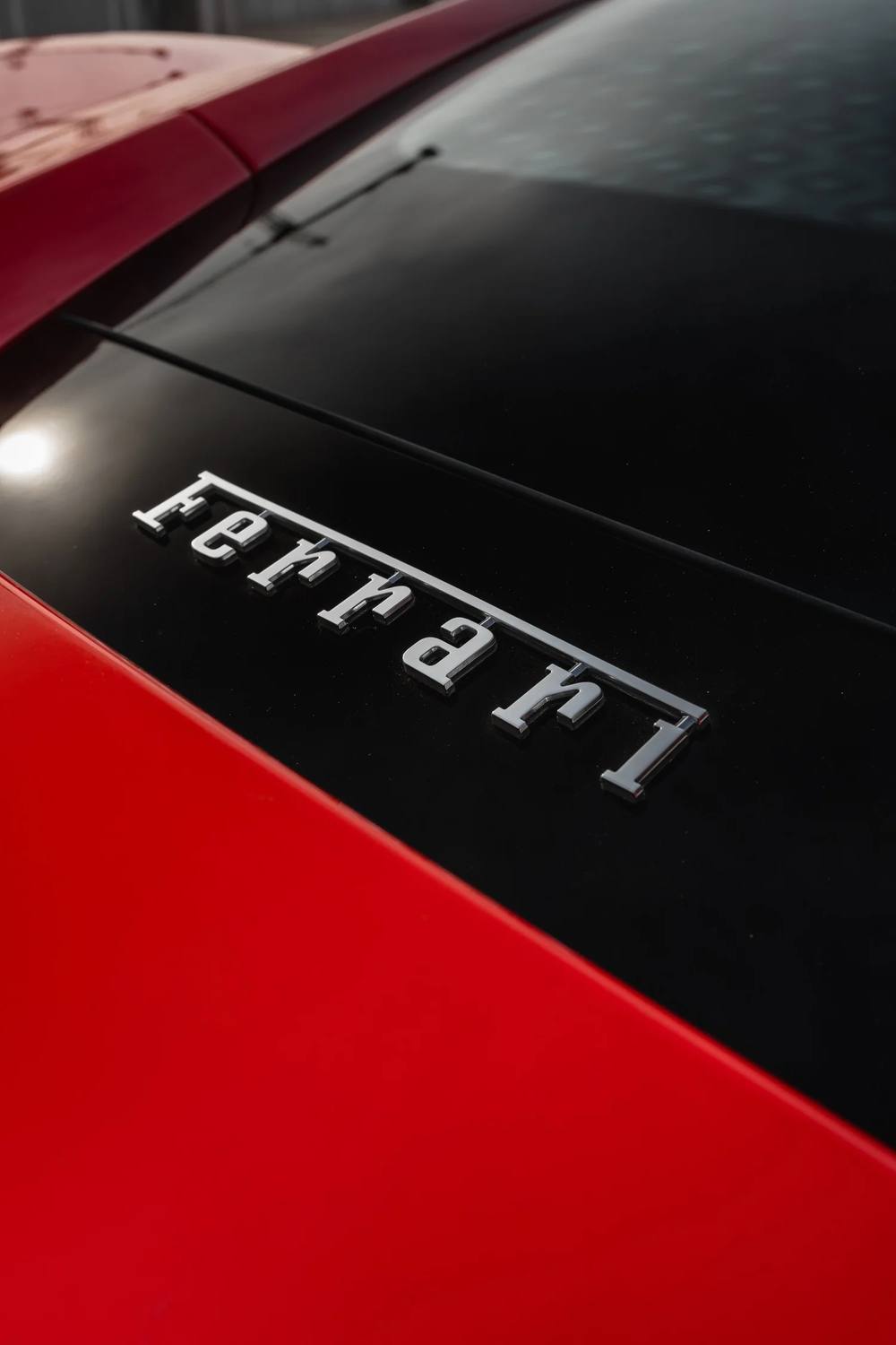 Ferrari script on red and black bodywork