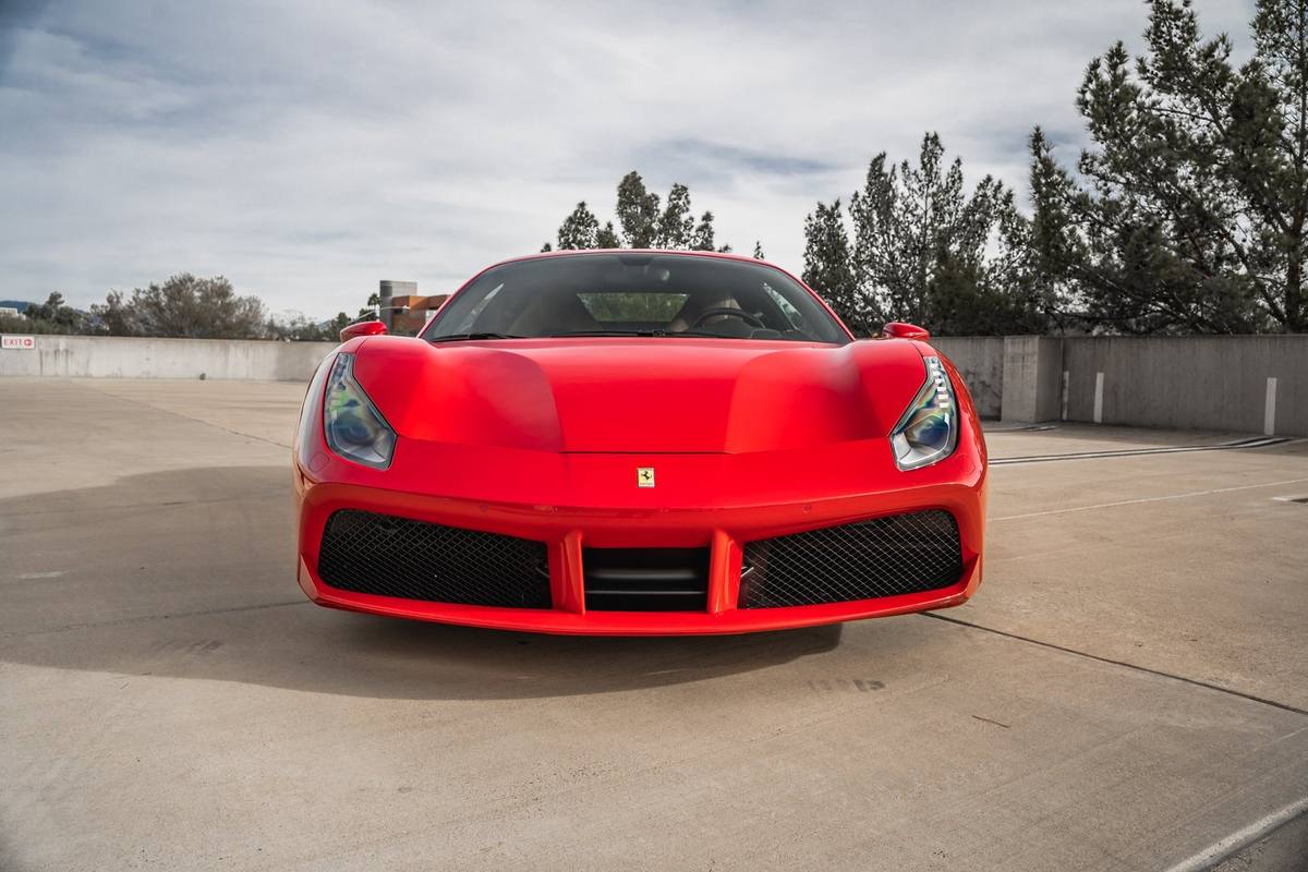 Red Ferrari 488 on a rooftop