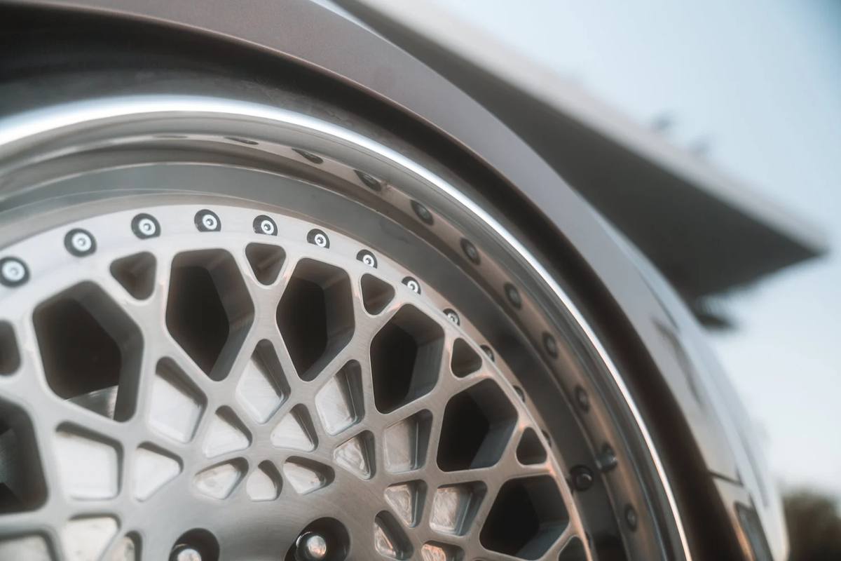 Mesh wheel detail under a fender