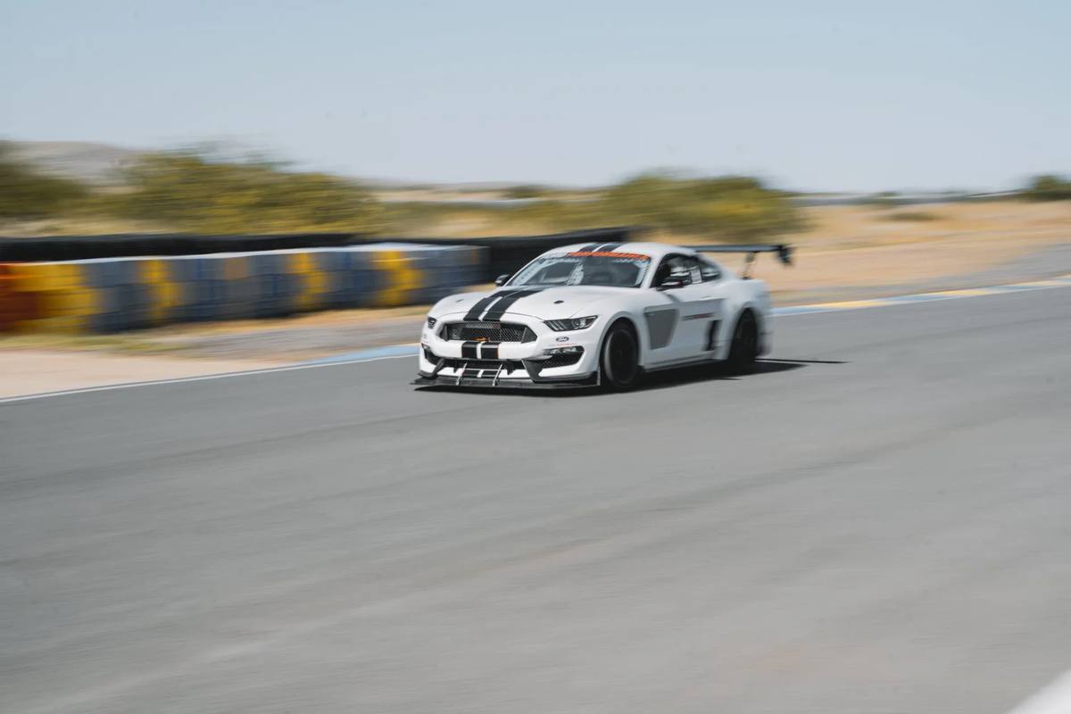 White Mustang on a racetrack
