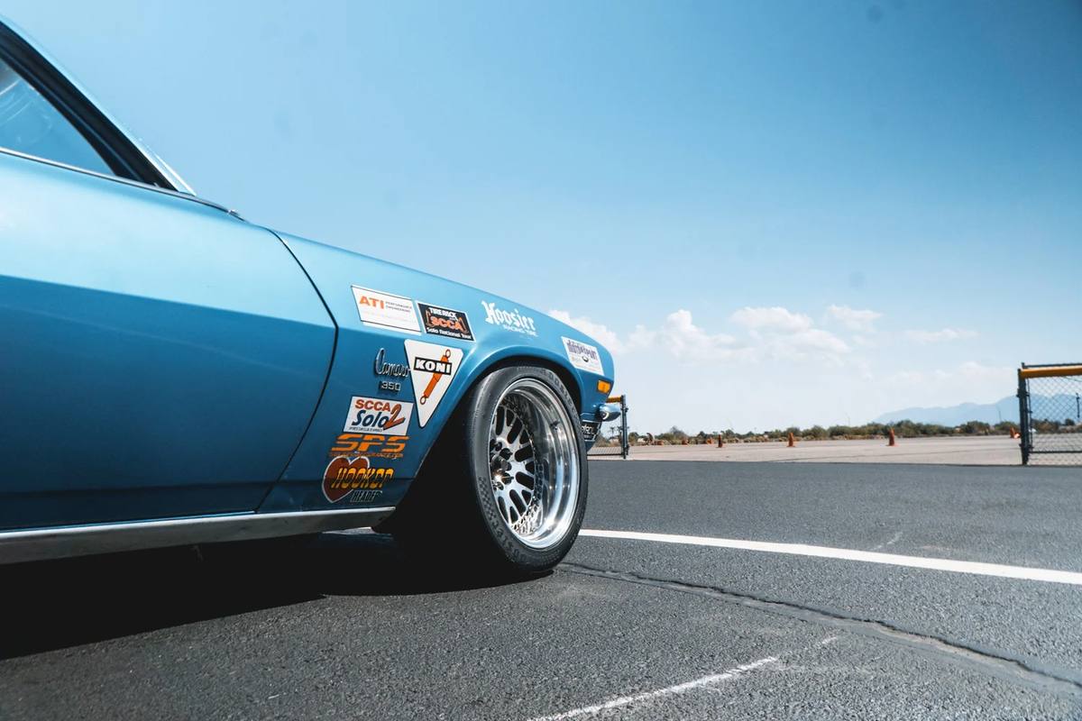 Blue vintage race car on a track