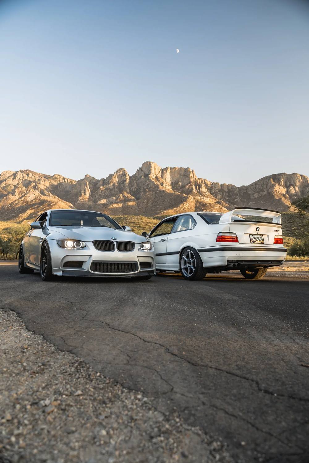 BMW M3s in front of Arizona mountains