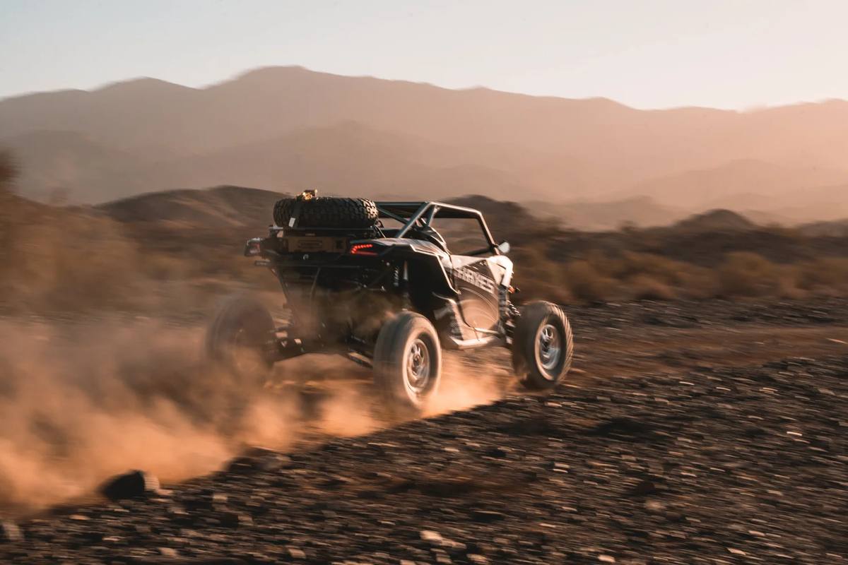 UTV kicking up dust in the desert